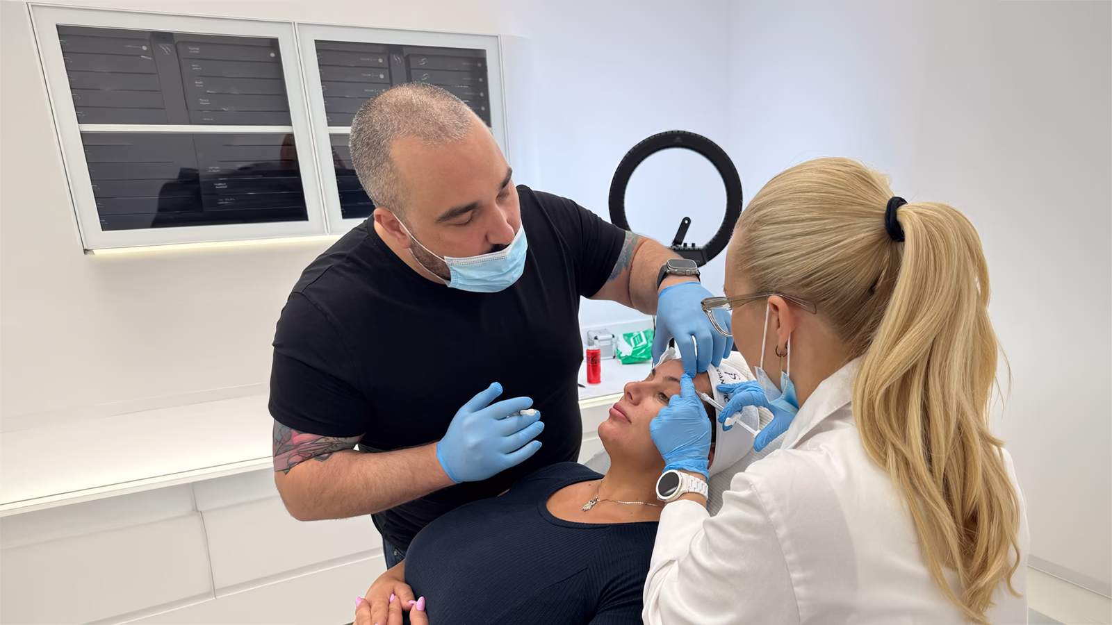 Demonstrating a treatment to a colleague at a Sinclair workshop in Belgrade, Serbia